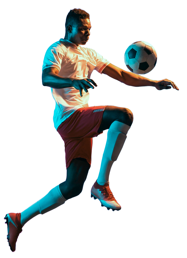 Professional footballer kicking ball